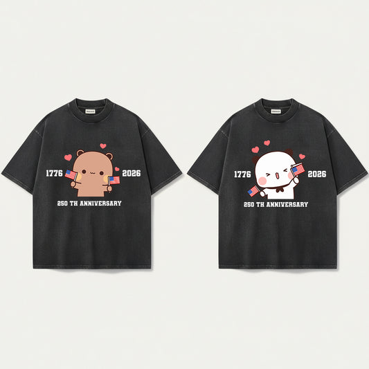 Two black t-shirts with cartoon characters and text on a white background